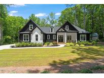 Charming two-story home featuring a manicured lawn and inviting curb appeal at 88 Priscilla Ln, Fuquay Varina, NC 27526
