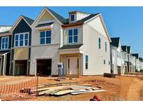 New construction home with white siding, large windows, and a front-entry two-car garage at 107 Ripple Way # 209, Clayton, NC 27520