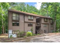 Neutral brown condos showcase a wooded setting, offering a serene and private living environment at 3086 Colony Rd # C, Durham, NC 27705