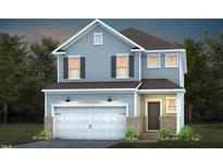 Charming two-story home with a two-car garage and classic architectural details at 416 Grange Farm Pl, Raleigh, NC 27603