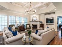 Spacious living room with coffered ceilings, fireplace and lots of natural light at 820 Parkridge Dr, Clayton, NC 27527