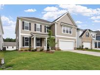 Charming two-story home with a manicured lawn, attached garage, and classic curb appeal at 94 Black Walnut Dr # 201, Garner, NC 27529