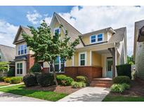 Charming two-story home with brick accents, well-maintained landscaping, and a welcoming front porch at 1304 Rodessa Run, Raleigh, NC 27607