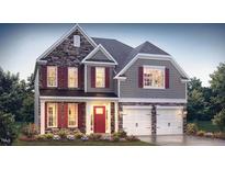 Inviting two-story home featuring a stone facade, red shutters, and a welcoming front porch at 409 Falls Bluff Dr, Wake Forest, NC 27596