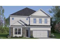 Charming two-story home with stone accents and a two-car garage at 413 Falls Bluff Dr, Wake Forest, NC 27587