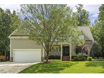 Charming home featuring a beautiful lawn and a two-car garage, providing ample space for parking at 4221 Bibleway Ct, Holly Springs, NC 27540