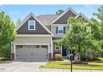 Charming two-story home featuring a two-car garage and well-maintained landscaping at 425 Cottonseed Way, Durham, NC 27703