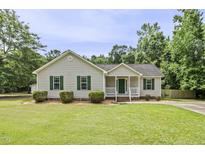 Charming one-story home with a well-manicured lawn and inviting front porch at 436 Madison Ave, Princeton, NC 27569
