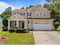 Charming two-story home with manicured lawn and a two-car garage, perfect for families at 504 Ashburn Ln, Durham, NC 27703