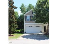 Charming two-story home featuring a two-car garage and well-maintained landscaping at 5126 Thornton Knoll Way, Raleigh, NC 27616