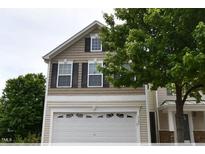 Charming two-story home features a white garage door and black shutters at 5126 Thornton Knoll Way, Raleigh, NC 27616