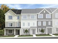 New three-story townhome with traditional siding and professionally landscaped front yard at 1430 Jay Rd, Knightdale, NC 27545