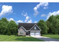Charming single-story home with a brick facade, two-car garage, and a well-manicured front yard at 196 Glen Hollow Dr, Raleigh, NC 27604