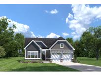 Charming home boasts a covered front porch, attached two-car garage, and well-manicured lawn at 197 Glen Hollow Dr, Raleigh, NC 27604