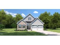 Charming two-story home with a mix of brick and siding, a two car garage, and well-manicured lawn at 198 Glen Hollow Dr, Raleigh, NC 27604