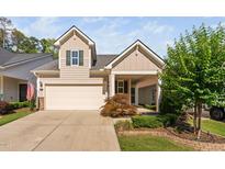 Charming two-story home with a two car garage, quaint landscaping, and covered porch at 1019 Santiago St, Durham, NC 27703