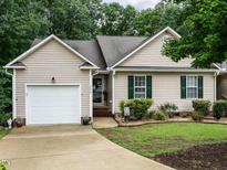 Charming single-story home with neutral siding, attached garage, and well-maintained landscaping at 3652 E Cotton Gin Dr, Clayton, NC 27527