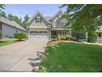 Charming two-story home with a well-manicured lawn and a two-car garage at 4229 Cats Paw Ct, Wake Forest, NC 27587
