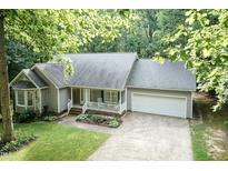 Charming single-story home with a two-car garage, well-manicured lawn, and inviting front porch at 140 Baron Cir, Youngsville, NC 27596