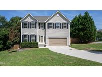 Charming two-story home with a manicured lawn, two-car garage and inviting curb appeal at 2725 Gross Ave, Wake Forest, NC 27587