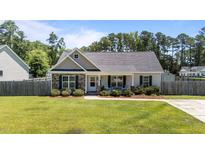Charming single-story home featuring stone accents, a cozy front porch, and a well-maintained lawn at 509 Par Dr, Nashville, NC 27856