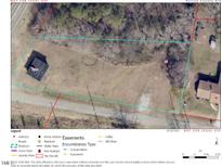 Aerial view of a property with a structure, outlining property lines and nearby road access at 5934 Boston Rd, Roxboro, NC 27574