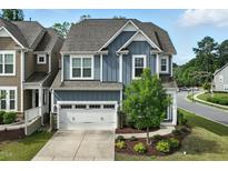 Charming two-story home with a two-car garage and landscaped front yard in a desirable neighborhood at 1313 Littlehills Dr, Apex, NC 27523