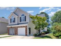 Charming two-story home with a brick-accented garage and well-maintained landscaping at 2053 Thornblade Dr, Raleigh, NC 27604