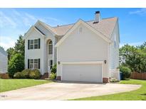 Charming two-story home with white siding, well-manicured lawn, and a two-car garage at 2644 Bloomsberry Ridge Dr, Fuquay Varina, NC 27526