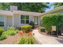 Charming home exterior featuring a well-manicured lawn and inviting walkway at 5905 Westcreek Pl, Raleigh, NC 27606