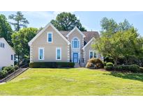 Charming home with a manicured lawn, mature trees, and a classic facade at 917 Haddon Hall Dr, Apex, NC 27502