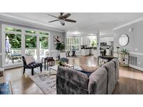 Open living room with hardwood floors, large windows, and stylish decor throughout at 12 Gatesway Ct, Durham, NC 27707