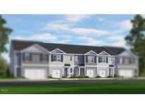New townhomes with private garages and classic light gray exteriors offer modern living at 142 Rusling Leaf Dr, Fuquay Varina, NC 27526
