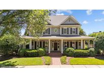 Charming two-story home with a welcoming front porch and well-manicured landscaping at 3306 Storybook Ln, Raleigh, NC 27614