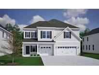 Charming two-story home featuring a two-car garage and welcoming front porch at 40 New Liberty Dr, Youngsville, NC 27596