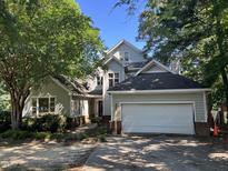 Charming two-story home with attached two-car garage and professionally landscaped front yard at 4917 Harbour Towne Dr, Raleigh, NC 27604