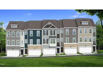 New townhomes show unique exteriors with stone accents and individual garages with well manicured lawn at 5904 Dunzo Dr, Raleigh, NC 27617