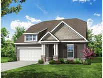 Charming exterior elevation with stone accents, gray siding, lush landscaping and inviting front porch at 95 Bald Cypress Ln, Youngsville, NC 27596
