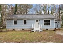 Charming single-story home with a welcoming front entrance and well-maintained exterior at 136 Dixie Ln, Youngsville, NC 27596