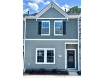 Charming townhouse with gray siding, black shutters, and well-maintained landscaping at 189 Seville Way, Clayton, NC 27520