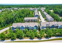 Community aerial view showcases well-maintained townhomes with lush landscaping and neighborhood streets at 4963 Highcroft Dr, Cary, NC 27519