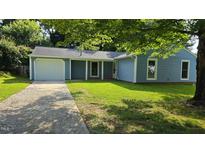 Charming single-story home with a well-maintained lawn and an attached one car garage at 2725 Westchester Dr, Burlington, NC 27217