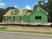 New home under construction with Zip System sheathing and exposed wooden framing at 8920 Thompson Mill Rd, Wake Forest, NC 27587