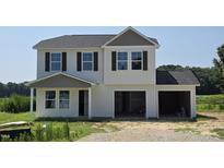Charming two-story home with attached two-car garage, in a rural setting at 3895 Josiah Ct, Nashville, NC 27856