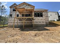 New home construction showing the partially completed back deck and foundation in a residential community at 49 Cloudview Ct, Pittsboro, NC 27312