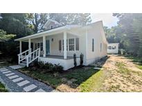 Charming single-story home with a welcoming front porch and well-maintained landscaping at 109 N Dunn St, Angier, NC 27501