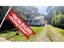 Charming one-story home with a inviting front porch and well-maintained yard with closing cost incentive at 109 N Dunn St, Angier, NC 27501