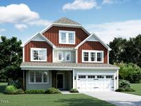 Charming two-story home featuring a covered front porch and attached two-car garage, nicely landscaped at 1204 Sparkling Lake Dr # 20, Apex, NC 27523