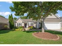 Charming home featuring mature landscaping, a well-maintained lawn, and a two-car garage at 621 Aylestone Dr, Cary, NC 27519