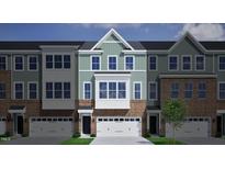 Charming brick townhome with attached garage and classic architectural details at 2112 Pink Peony Cir # 149, Durham, NC 27703